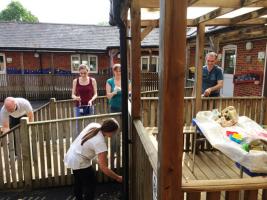 A group of Volunteers from different Companies working as a team on a Rotary Project.